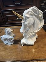 Front view of both unicorn sculptures