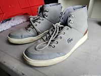 Full view of both sneakers left side