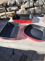 All three red/black stoneware baking dishes displayed
