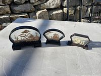 All three miniature dioramas on stands