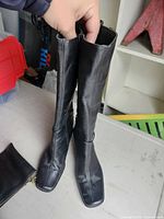 Full view of both boots standing upright