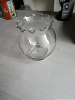 overall view of clear glass bowl with ruffled rim