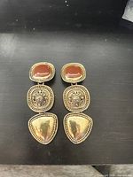 Front view of both earrings showing design and stones