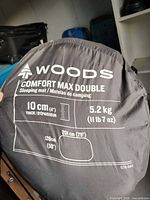 Carry bag showing printed specifications and Woods branding