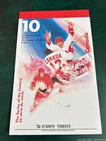 Front cover of booklet showing denomination and series artwork