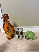 Front view of three hand-blown glass animal figurines