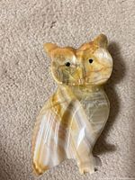 Front view of banded onyx owl figurine