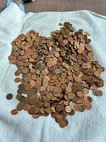 Pile of Canadian pennies spread on towel