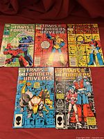 All five comics laid out showing covers