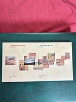 Front of presentation folder showing Group of Seven montage