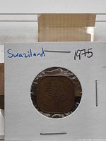 Coin in 2x2 flip front view wider shot