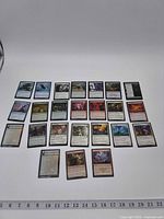 Overview of all 24 Magic: The Gathering cards laid out in four rows