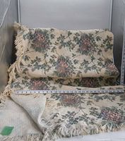 Afghan draped to show full pattern and fringe with measuring tape visible