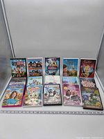 All 15 DVD cases laid out, front covers visible