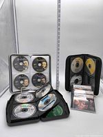 Overall view of open binder, zip wallet, standing case and jewel cases