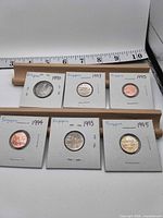 All six coins in flips, years visible