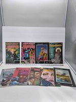 All nine bagged comic books laid out showing covers