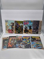 Group shot of all nine bagged comics