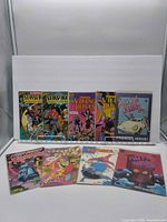 All nine comic books front covers visible