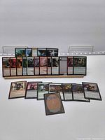 Group of approximately 25 MTG cards displayed front and back