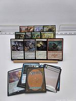 Front and back view showing assortment of MTG cards