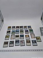 Full layout of all 25 cards with ruler for scale