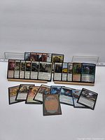 Full lot of 26 Magic cards displayed on stands and laid out