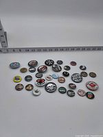 All pins arranged with ruler showing scale