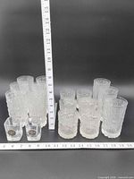 Full group of 17 glasses with ruler for scale