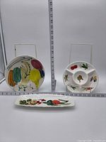 All three ironstone serving pieces displayed with ruler for scale