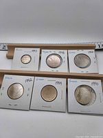 All six coins in flips showing obverse or reverse