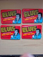 Front view of four sealed Elvis Collectors Series bubble gum card packs