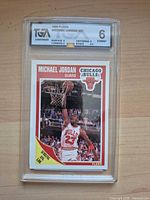 Front view of TGA-slabbed 1989 Fleer Michael Jordan #21 card showing grade label and card image