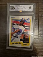 Front of TGA-slabbed 1990 Fleer Ken Griffey Jr. #513 showing label and card