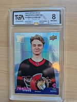 Front view of TGA-slabbed Tim Stützle rookie card showing holographic design and grade label