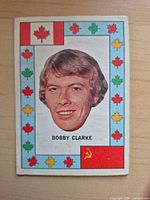 Front of Bobby Clarke O-Pee-Chee Summit Series trading card showing portrait and decorative maple leaf border