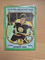 Front of Bobby Orr 1972-73 card showing player image and card number