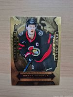 Front of Brady Tkachuk Pure Gold parallel card