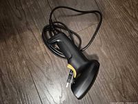 Barcode scanner full view showing cable and grip