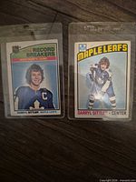 Fronts of both Darryl Sittler trading cards in sleeves