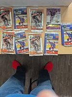 Eight of the nine Upper Deck Gretzky 99 wrappers spread on table