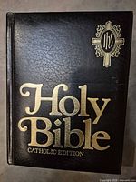 Front cover showing title, material, and emblem