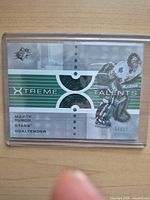 Front of Upper Deck SPx Xtreme Talents Marty Turco jersey patch card showing fabric swatch and serial number