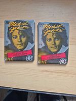 front view of two sealed Michael Jackson trading card packs