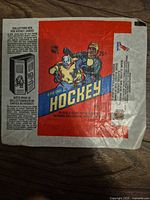 Front of 1970s O-Pee-Chee hockey wax wrapper showing graphics and wear
