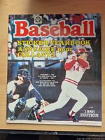 Front cover of 1986 Baseball Sticker Yearbook showing batting player, bilingual title and 35¢ price