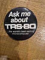 Close-up of round TRS-80 promotional button