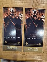 Front view of two Batman Begins tickets showing artwork, date, logos and Admit One text