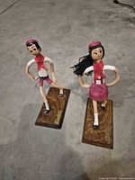 Front view of both figurines showing outfits and stance