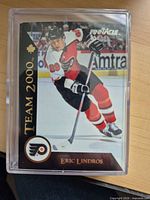 Front view of Eric Lindros Team 2000 Pinnacle insert card inside protective case